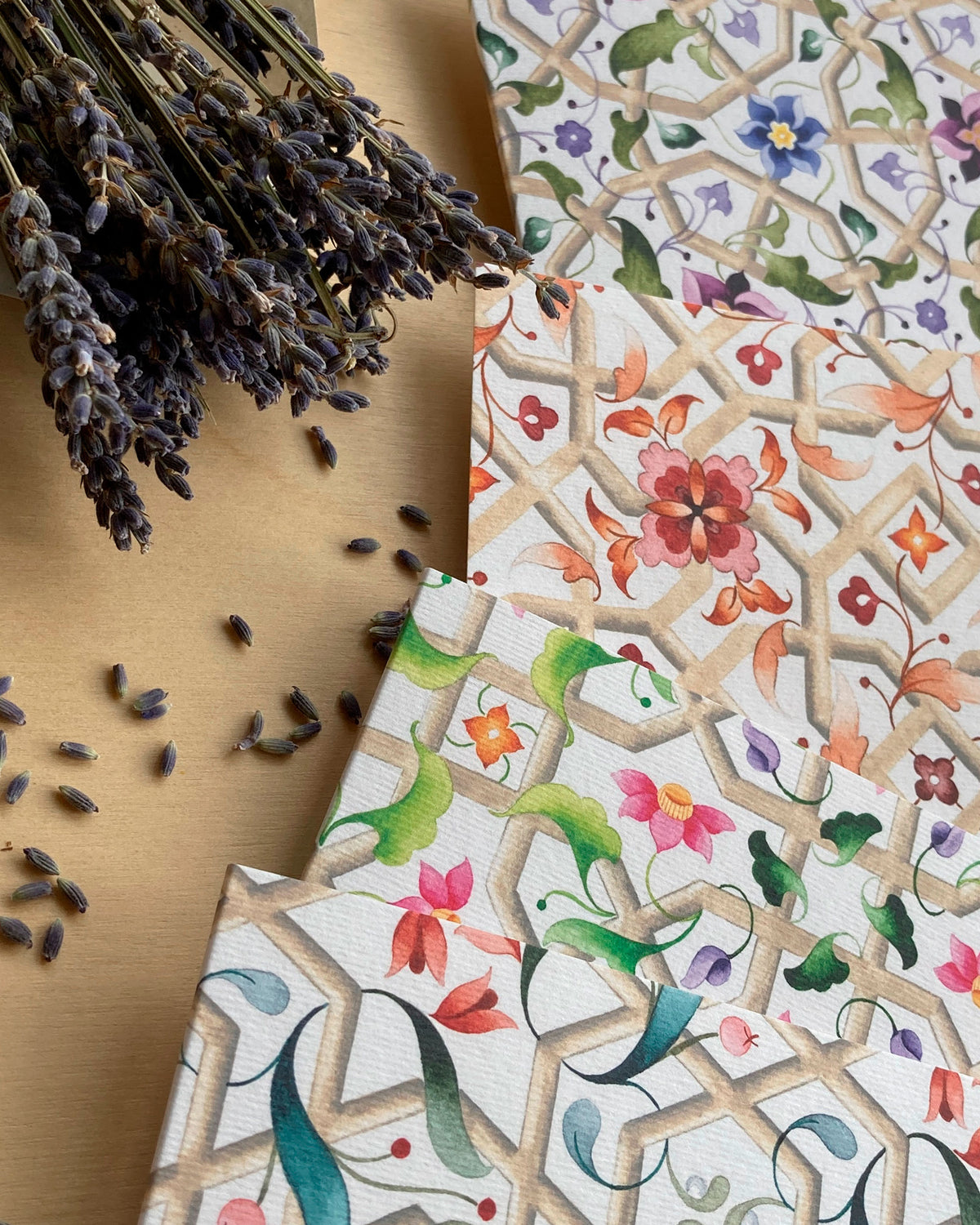 Close-up edges of 4 colourful, elegant watercolour fine art cards