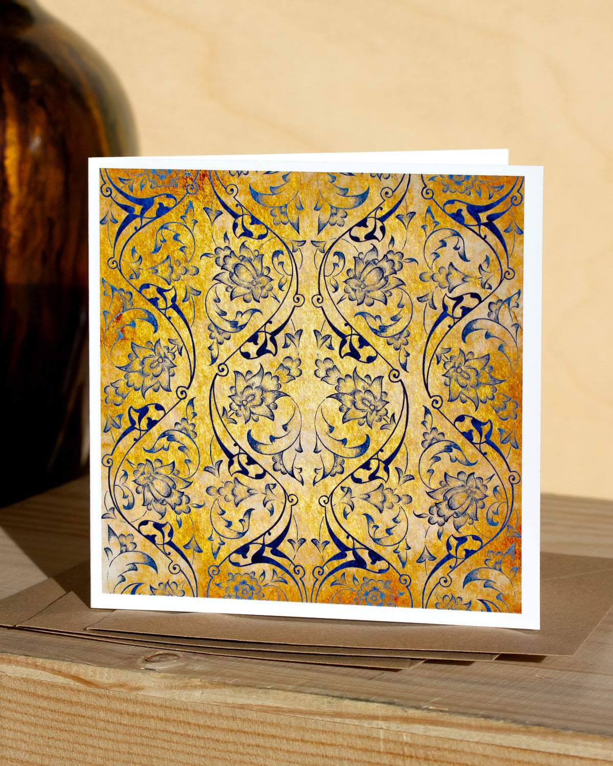 Square, yellow and blue christmas card with ornamental pattern and white border