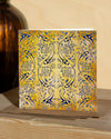 Square, yellow and blue christmas card with ornamental pattern