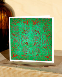 Square, green and red christmas card with ornamental pattern and white border