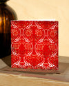 Square, red and white christmas card with ornamental pattern