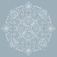 Elegant art print of white botanical motifs in a circular design against a pastel blue background